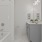 well lit bathroom with shower/tub combo