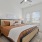 windows brighten large bedroom