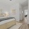 large bedroom with wood flooring