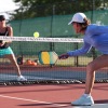 a couple plays pickleball
